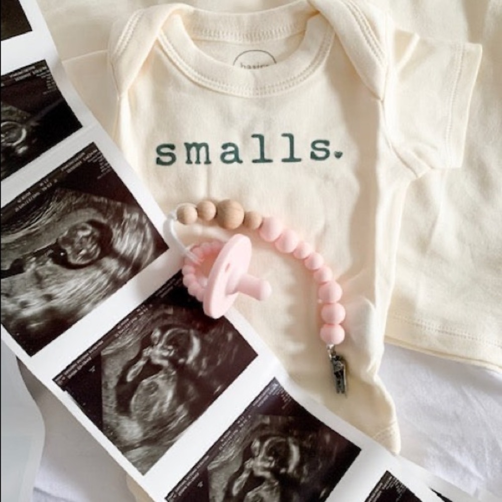 This Smalls Bodysuit pairs well with the "Biggie Tee"! 100% cotton.